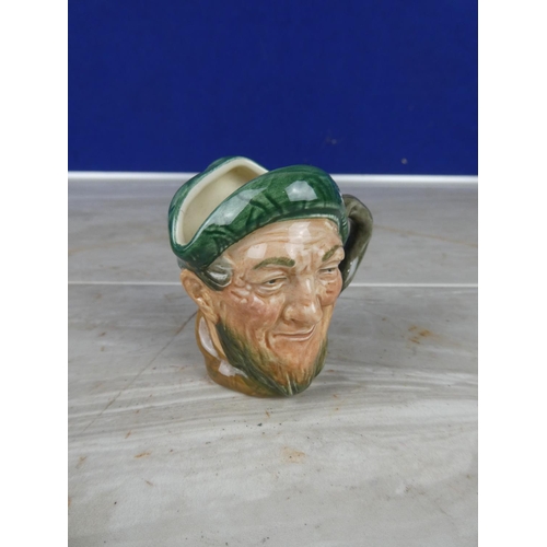 912 - A Royal Doulton mask jug.