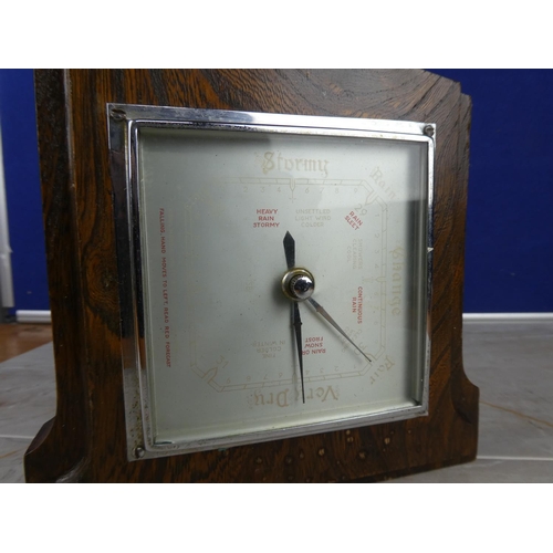 916 - A vintage oak cased barometer.