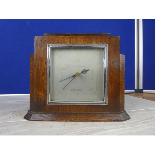 917 - A vintage oak cased barometer.