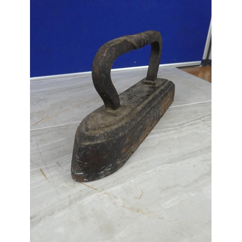 918 - An antique slug iron.