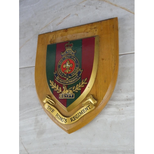 924 - A wooden shield wall plaque 'The King's Regiment'.17cm.