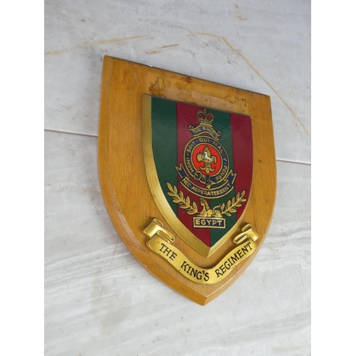 924 - A wooden shield wall plaque 'The King's Regiment'.17cm.