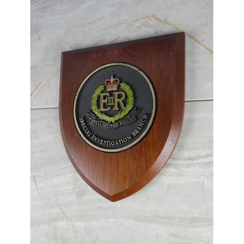 925 - A wooden shield wall plaque 'Royal Military Police - Special Investigation Branch'. approx 21cm.