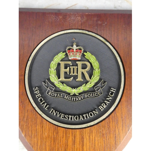 925 - A wooden shield wall plaque 'Royal Military Police - Special Investigation Branch'. approx 21cm.