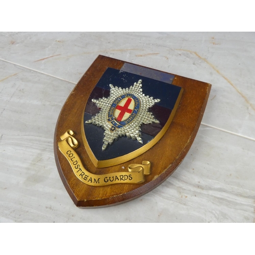 932 - A wooden shield wall plaque 'Coldstream Guards - Presented to CID Waterside from Sid Cooper'.17cm.