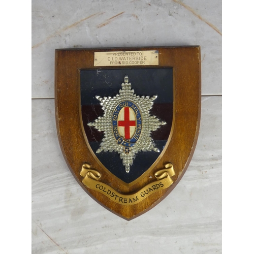 932 - A wooden shield wall plaque 'Coldstream Guards - Presented to CID Waterside from Sid Cooper'.17cm.