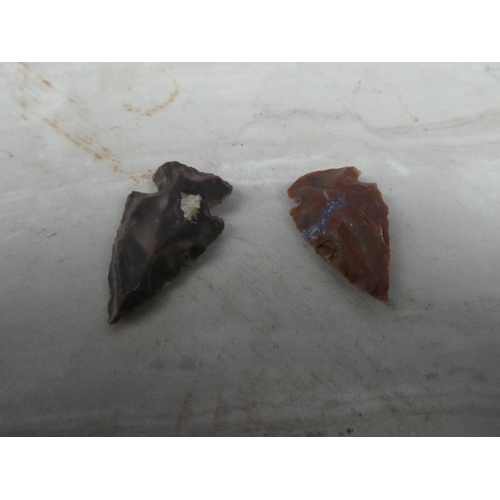 935 - An interesting lot of two knapped arrowheads.