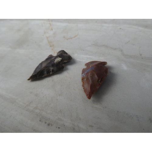 935 - An interesting lot of two knapped arrowheads.