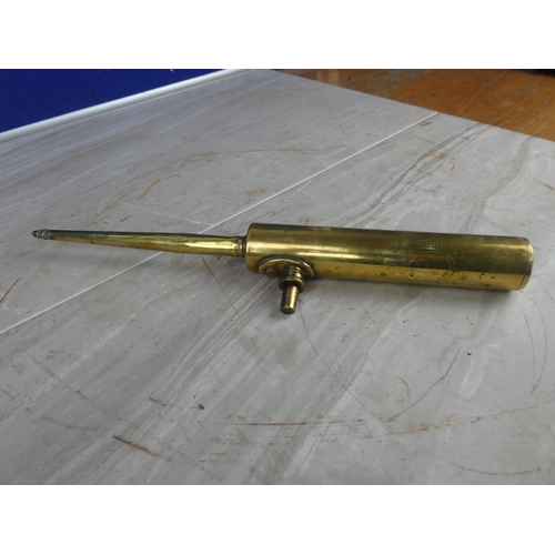 941 - An antique brass oil gun.