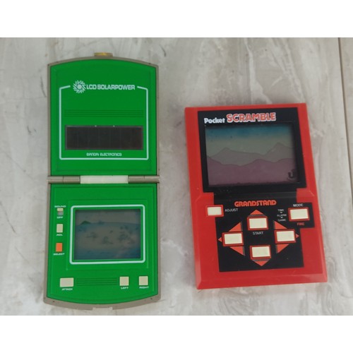 345 - A LCD Bandai Electronics handheld game console and a Pocket Scramble Grandstand 1983 Epoch Co handhe... 