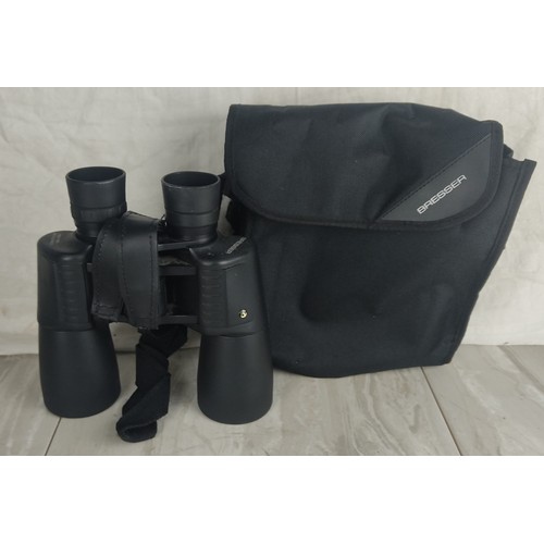 351 - A pair of Bresser binoculars with carry case.