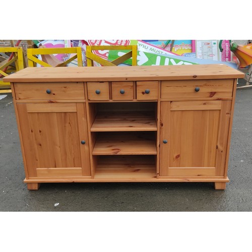 955 - A large pine sideboard.