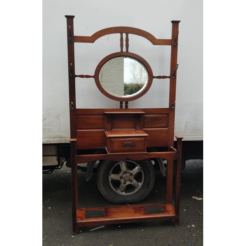 957 - An antique mirror back hallstand.