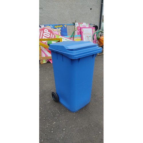 960 - A blue wheelie bin.