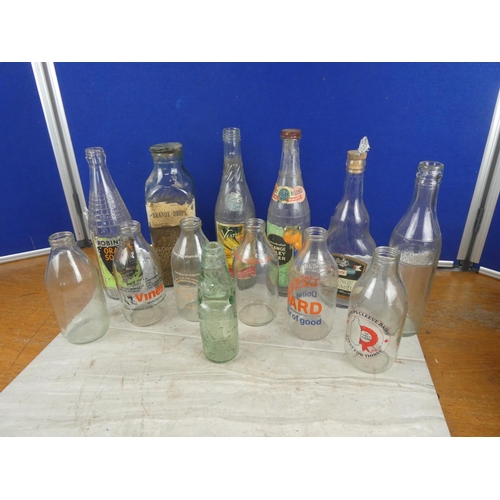 1221 - A collection of vintage milk bottles and more.