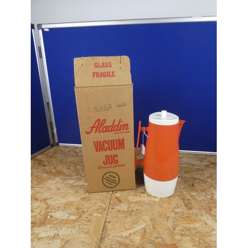 1250 - A vintage Aladdin water pitcher in original box.