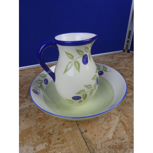 1266 - A pottery jug and basin set.