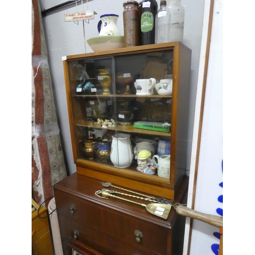 1268 - A vintage two door cabinet with sliding glass doors.