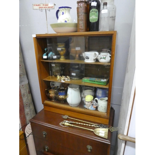 1268 - A vintage two door cabinet with sliding glass doors.