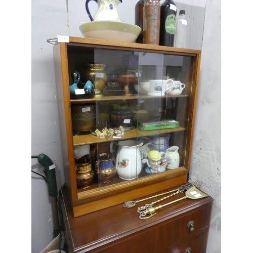 1268 - A vintage two door cabinet with sliding glass doors.