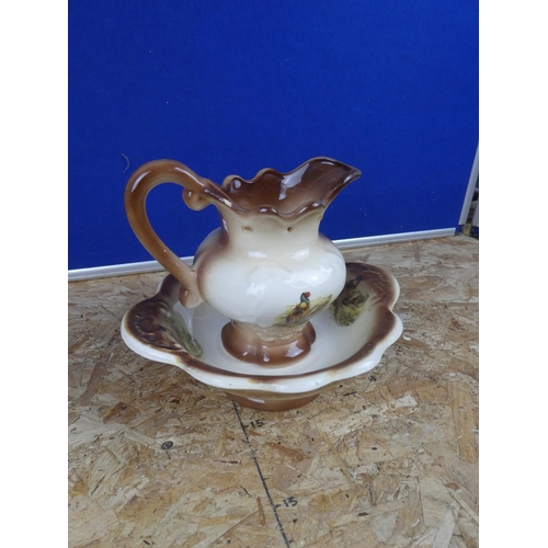 1288 - A pottery jug and basin set.