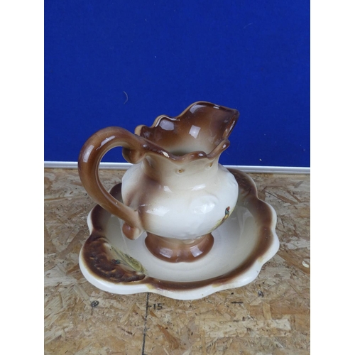 1288 - A pottery jug and basin set.