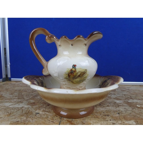 1288 - A pottery jug and basin set.