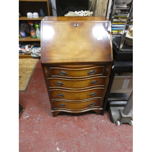 1292 - A stunning small bow fronted writing bureau with key.