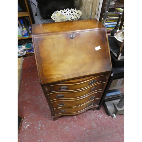 1292 - A stunning small bow fronted writing bureau with key.