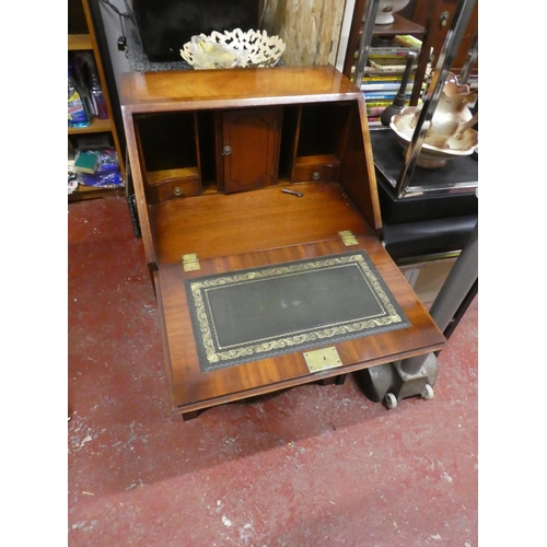 1292 - A stunning small bow fronted writing bureau with key.