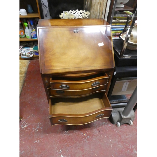 1292 - A stunning small bow fronted writing bureau with key.