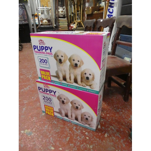 1302 - 2 boxes of Puppy training pads.