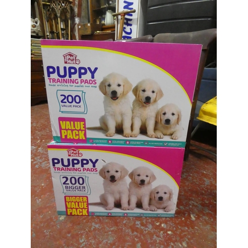 1302 - 2 boxes of Puppy training pads.