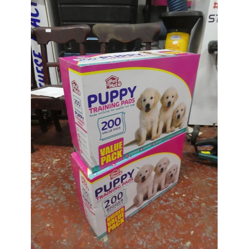 1302 - 2 boxes of Puppy training pads.