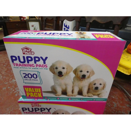 1302 - 2 boxes of Puppy training pads.