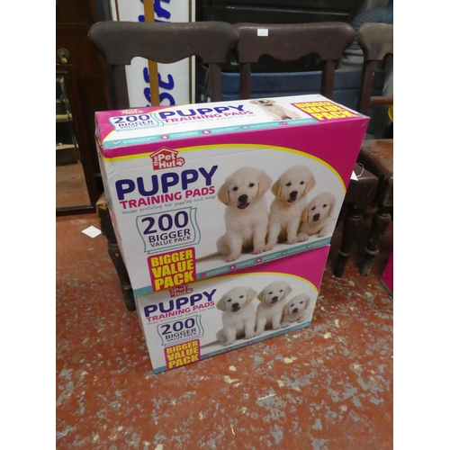 1303 - 2 boxes of Puppy training pads.