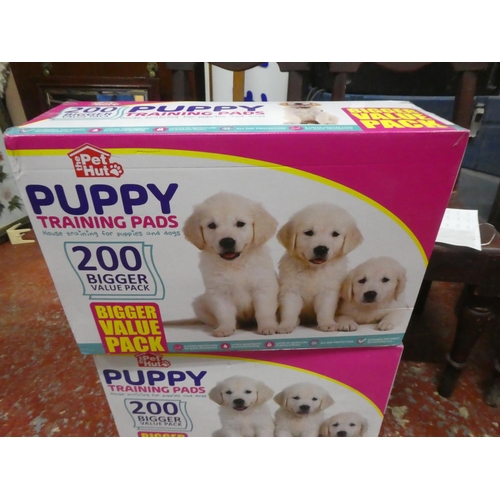 1303 - 2 boxes of Puppy training pads.