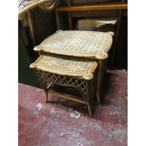 1305 - A nest of two wicker tables.