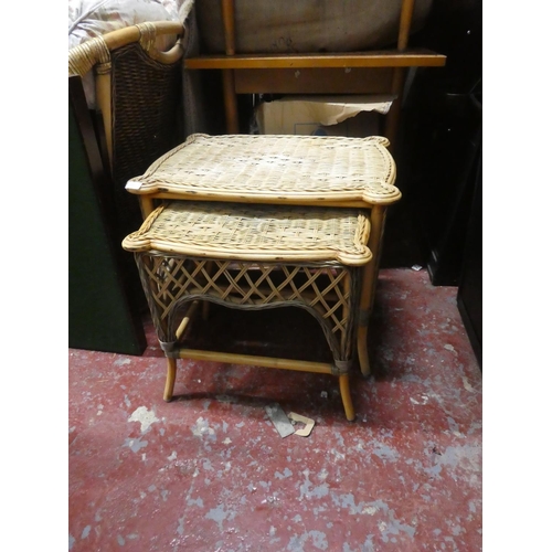 1305 - A nest of two wicker tables.