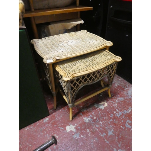 1305 - A nest of two wicker tables.