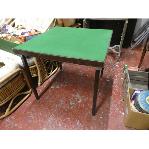 1306 - A folding card table with green felt top.