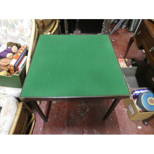 1306 - A folding card table with green felt top.