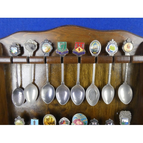 1309 - A large assortment of souvenir spoons with wall mountable display unit.