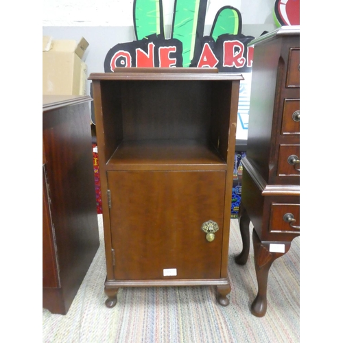 1314 - A bedside locker with decorative brass fittings.