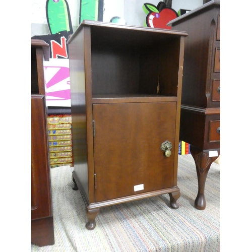 1314 - A bedside locker with decorative brass fittings.