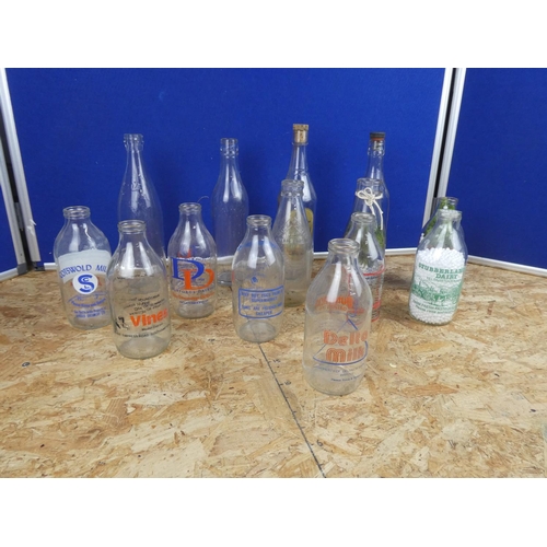 1330 - A collection of vintage milk bottles and more.