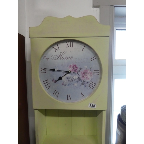 128 - An unusual slimline painted display unit with clock. Approx 187cm.