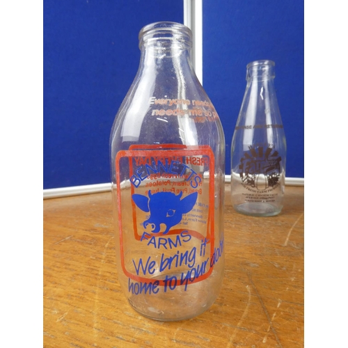 308 - A large collection of vintage milk bottles.