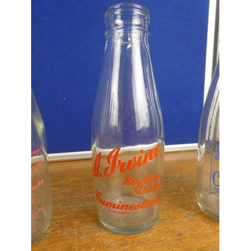 308 - A large collection of vintage milk bottles.