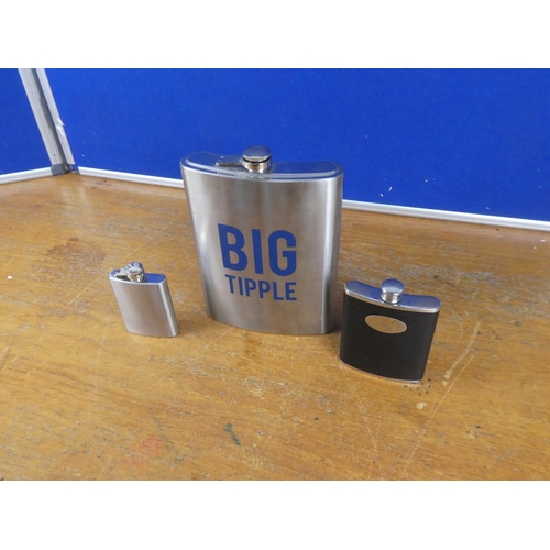 390 - A 'Big Tipple' stainless steel hip flask and two others.